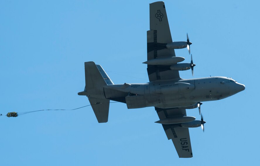 A C-130 Hercules transport aircraft from the Montana Air National Guard 120th Airlift Wing drops a Heavy Equipment load on the flight line May 29, 2019, at Malmstrom Air Force Base, Mont.