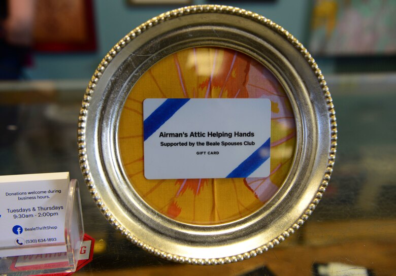 A photo of a gift card sitting in a circular frame.