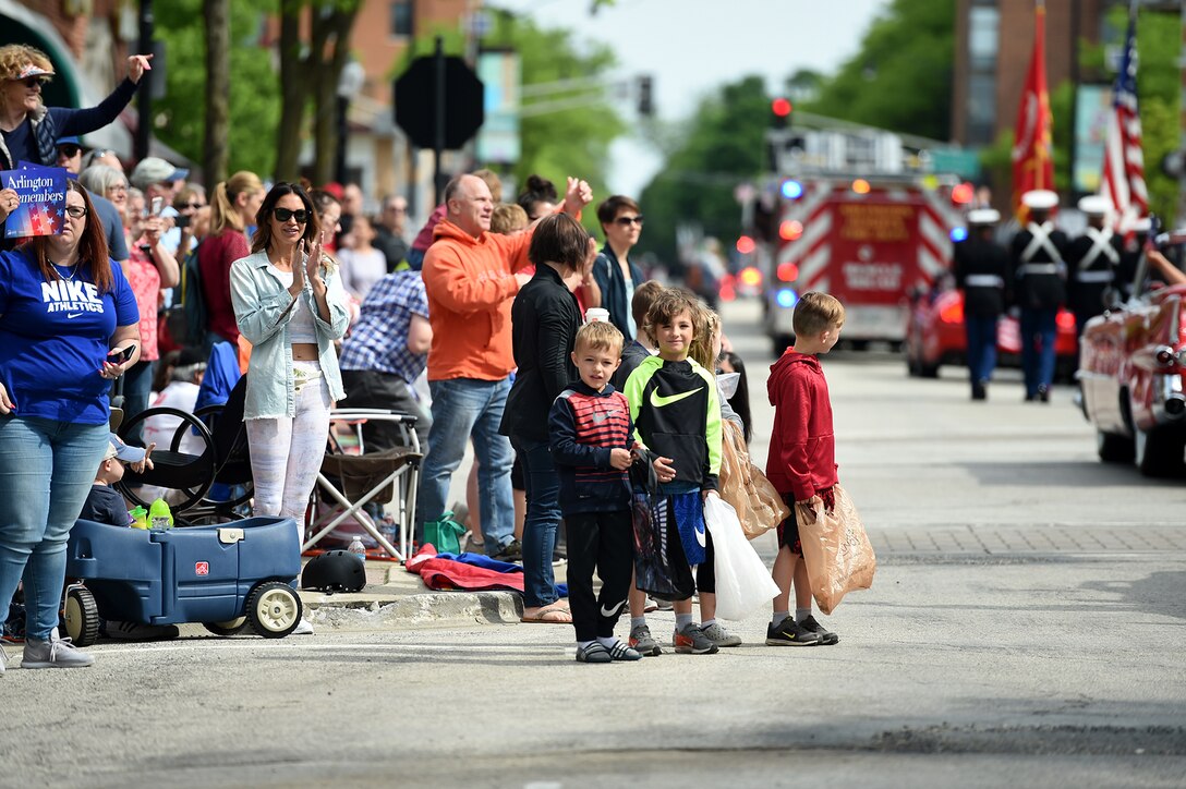 Children look on during the Village of Arlington Heights Memorial Day parade, Mar. 27, 2019.
