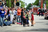 Children look on during the Village of Arlington Heights Memorial Day parade, Mar. 27, 2019.
