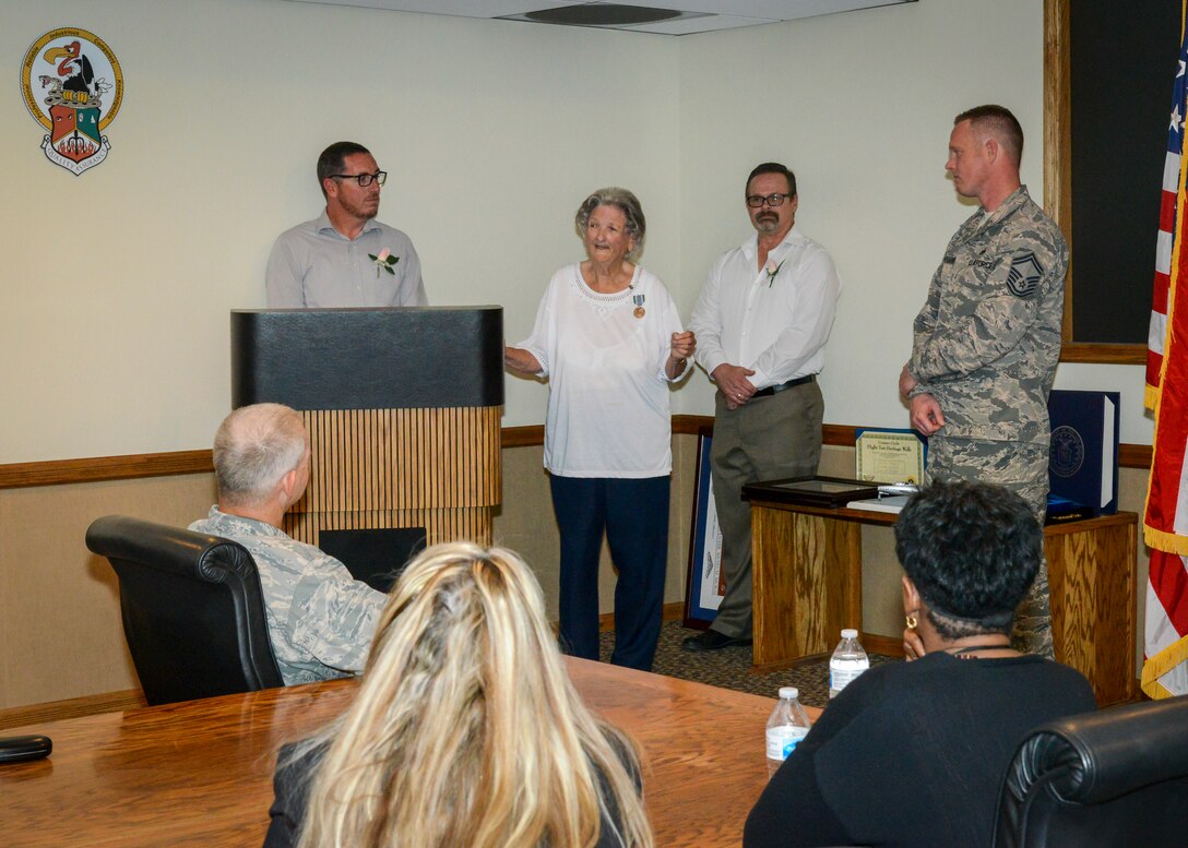 Patricia Henrich, 412th Maintenance Group, shares a story with her colleagues during her retirement ceremony at Edwards Air Force Base, Calif., May 31. Henrich retired after 67 years of federal civilian service. (U.S. Air Force photo by Giancarlo Casem)