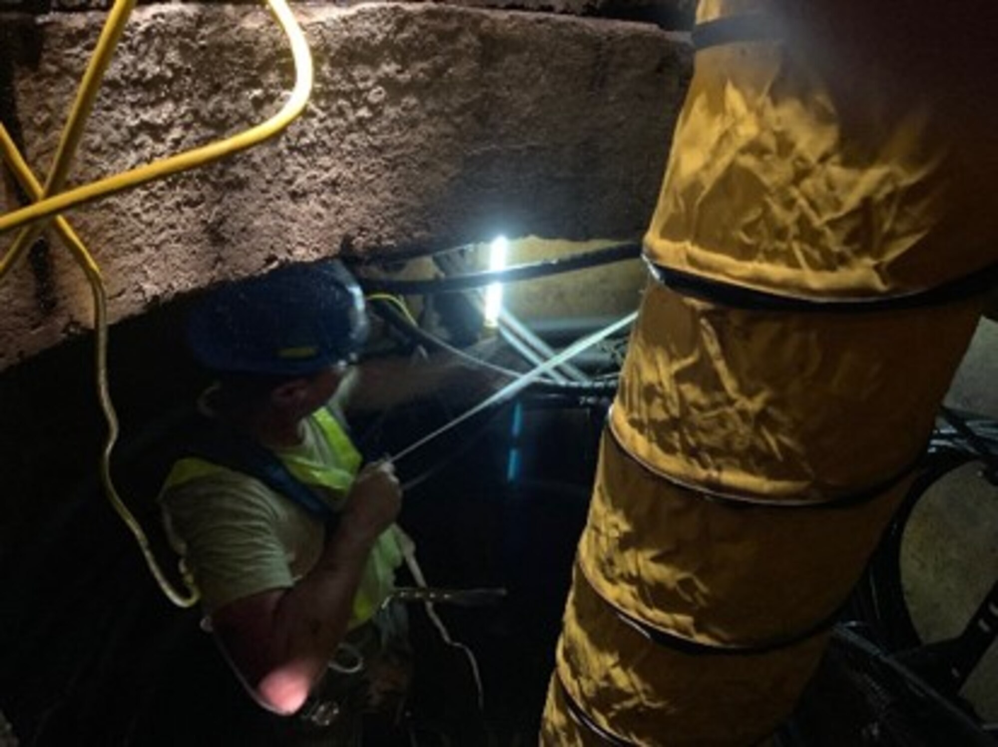 An 210th Engineering Installation Squadron Airman from the Minnesota Air National Guard replaces cable underneath Patrick Air Force Base on Feb. 21, 2019. (Courtesy photo)