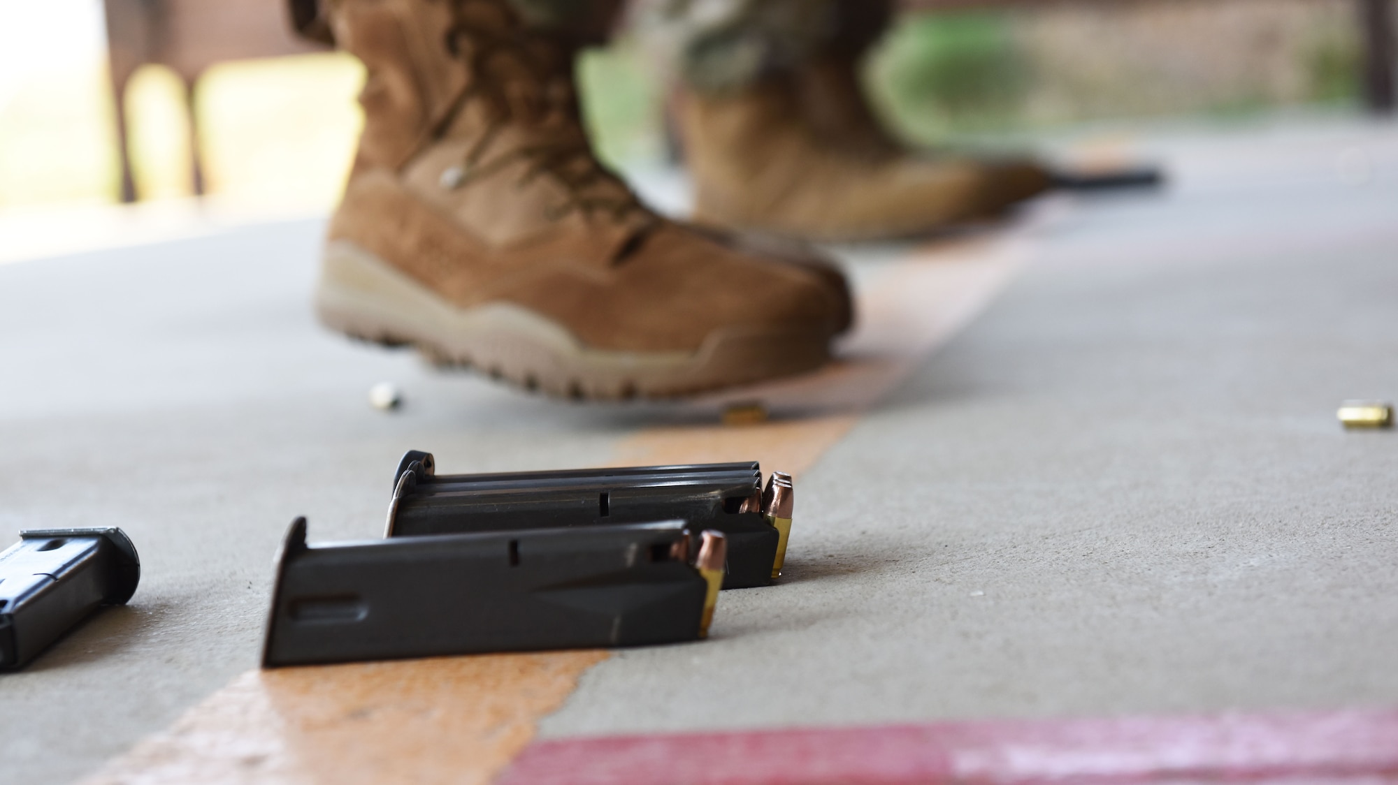 Loaded magazines lie on the floor of the firing range prior to use during the Excellence in Competition shooting event Oct. 28, 2019, at Incirlik Air Base, Turkey. Contestants who placed among the top ten contenders won the right to wear the EIC badge on their service dress uniforms.. (U.S. Air Force photo by Staff Sgt. Joshua Magbanua)