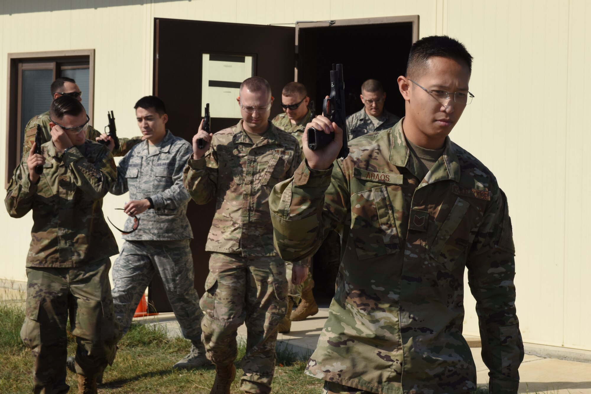 U.S. Air Force Airmen carry M9 pistols to the firing range during a shooting competition Oct. 28, 2019, at Incirlik Air Base, Turkey. The 39th Security Forces Squadron hosted an Excellence in Competition shooting event in which participants compete for the recognition of being among Incirlik’s best shooters. (U.S. Air Force photo by Staff Sgt. Joshua Magbanua)