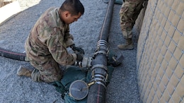 Spc. Godswill Orzabal, petroleum supply specialist, 574th Composite Supply Company, closes a valve at the fuel station supply point at Erbil, Iraq, Oct. 15, 2019.