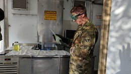 Pfc. Stefan Moreno, petroleum supply specialist, 574th Composite Supply Company, conducts a visual sight test on a batch of fuel at Erbil, Iraq, Oct. 16, 2019. Moreno is making sure the fuel is clear of debris by checking for contaminants and discoloration.