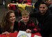 Airman 1st Class Joshua Bruner (right), 26th Operational Weather Squadron weather forecaster, poses for a photo with his wife, Deana (left) and his son, Dominic (middle), during the Exceptional Family Member Program’s Dinner with Sparky at Barksdale Air Force Base, La., Oct. 11, 2019. (U.S. Air Force photo by Airman 1st Class Lillian Miller)