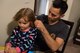 Airman 1st Class Joshua Bruner, 26th Operational Weather Squadron weather forecaster, helps his daughter, Juliana, with her hair at Barksdale Air Force Base, La., Oct 19, 2019. (U.S. Air Force photo by Airman 1st Class Lillian Miller)