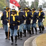 Members of the Bexar County Buffalo Soldiers march into the San Antonio National Cemetery Nov. 11, 2018, for the annual Bexar County Buffalo Soldiers Commemorative Ceremony. Comprised of former slaves, freed men and Black Civil War veterans, the historic Buffalo Soldiers persevered through the most difficult conditions imaginable to become some of the most elite and most decorated units in the U.S. Army.