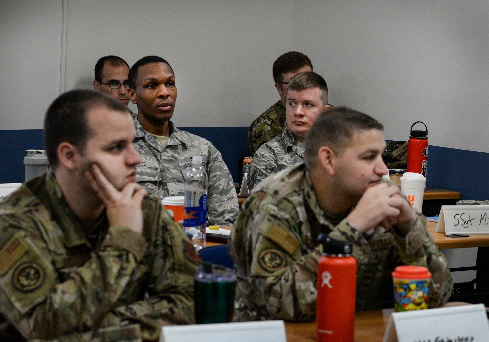 Staff sergeants discuss scenarios in an ethics briefing during the Noncomissioned  Officer Performance Enhancement Seminar at the Education Center on Hanscom Air Force Base, Mass., Oct. 29. Sixteen staff sergeants attended the seminar, which is meant to expand on lessons learned in previous professional military educations, and covered topics such as leadership theories, stress management, as well as nutrition and exercise. (U.S. Air Force photo by Lauren Russell)