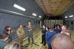 Tech. Sgt. Joshua Green, 356th Airlift Squadron loadmaster, describes the 433rd Airlift Wing’s C-5M Super Galaxy’s cargo carrying capabilities to Inter-American Air Forces Academy students Oct. 30, 2019 at Joint Base San Antonio-Lackland.