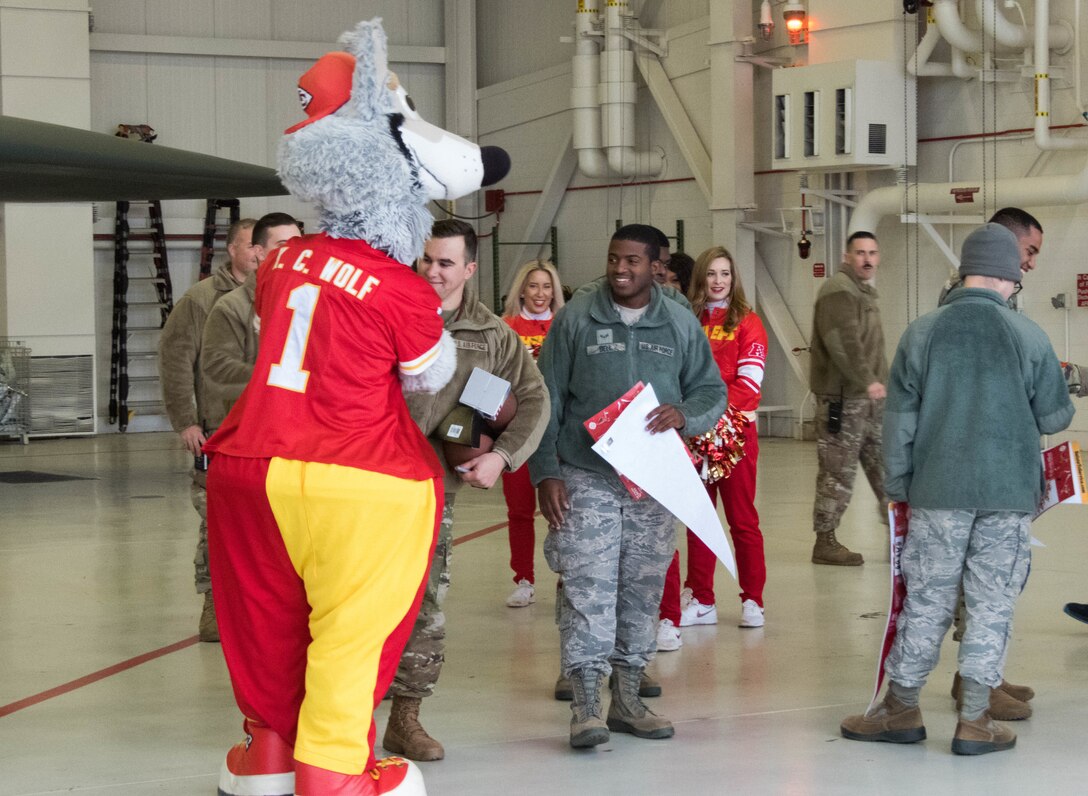 K.C. Wolf, the official mascot of the National Football League’s Kansas City Chiefs, meets with Airmen during a B-2 Spirit tour at Whiteman Air Force Base, Missouri, Oct. 29, 2019.