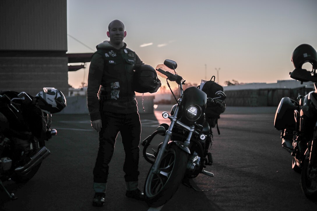 U.S. Marine Corps Staff Sgt. Brian Tunks, a Marine with Marine Wing Headquarters Squadron (MWHS) 3, 3rd Marine Aircraft Wing (MAW), poses for with his motorcycle during the MWHS-3 Motorcycle Club ride at Marine Corps Air Station Miramar, Calif., Oct., 31, 2019. The club conducted a unit ride to promote motorcycle safety awareness, enhance motorcycle handling skills, improve unit cohesiveness and boost awareness of the motorcycle safety program in the squadron. (U.S. Marine Corps photo by Lance Cpl. Juan Anaya)