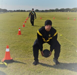 Staff Sgt. Jose Lopez, 470th Military Intelligence Brigade mechanic shop foreman, prepares to throw a 10-pound ball overheard as part of his training for the Army Combat Fitness Test Fitness Leaders Class at Joint Base San Antonio-Fort Sam Houston Oct. 31. The class provided classroom and hands-on instruction to Army physical trainers and master fitness trainers on the proper techniques to train and prepare service members to pass the new Army Combat Fitness Test that will take effect in October 2020.