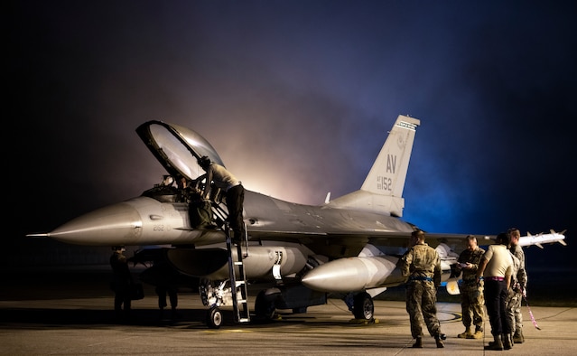 Airmen prepare an F-16 Fighting Falcon for takeoff