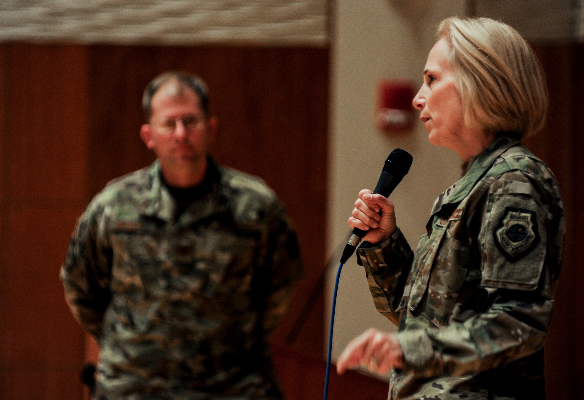 Lt. Gen. VeraLinn “Dash” Jamieson, Deputy Chief of Staff for Intelligence, Surveillance, Reconnaissance and Cyber Effects Operations, delivers her perspective on the future fight to members of the National Air and Space Intelligence Center while NASIC Commander Col. Parker Wright stands side-stage. (U.S. Air Force photo by Senior Airman Samuel Earick)