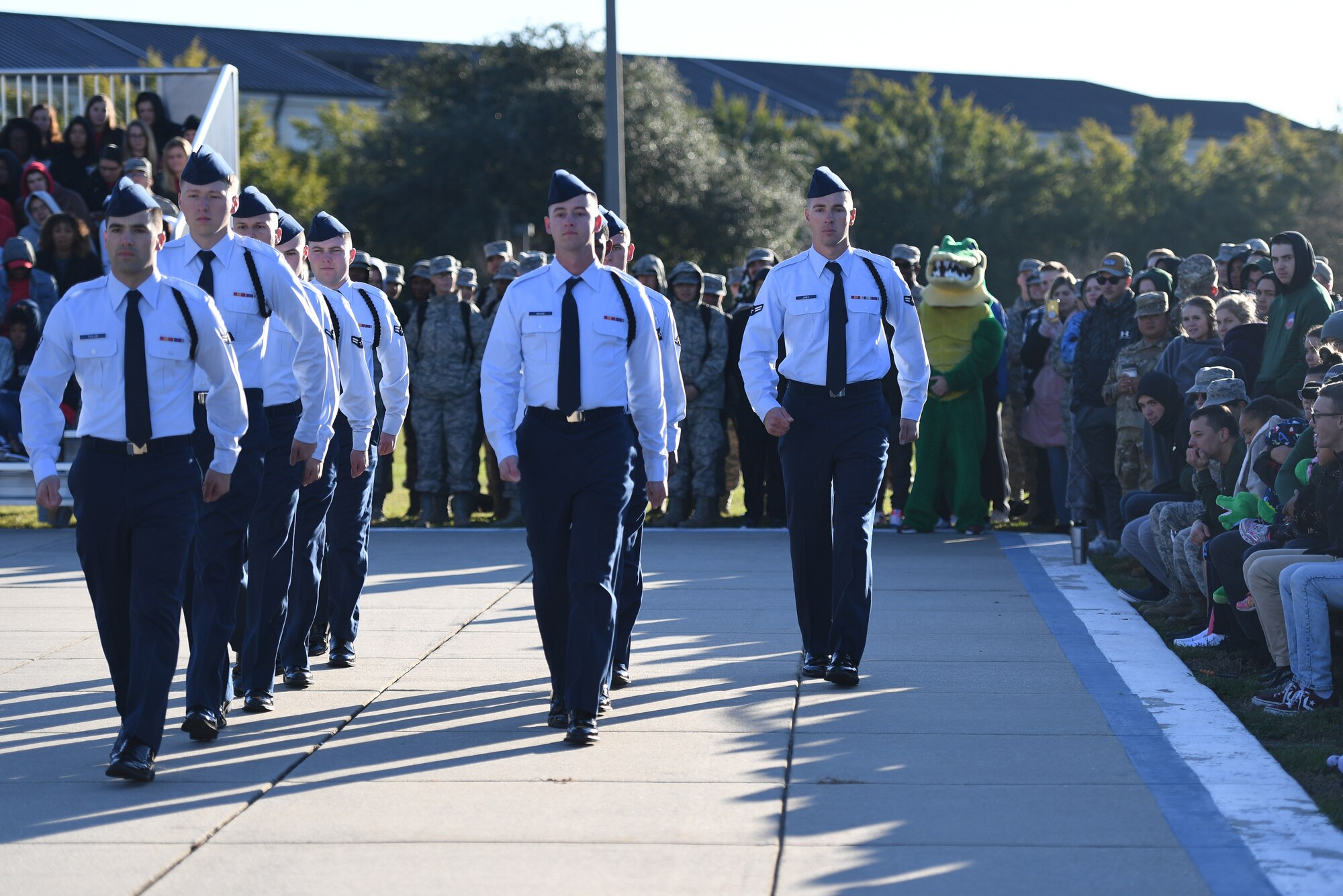 Members of the 334th Training Squadron regulation drill team perform during the 81st Training Group drill down on the Levitow Training Support Facility drill pad at Keesler Air Force Base, Mississippi, Nov. 1, 2019. Airmen from the 81st TRG competed in a quarterly open ranks inspection, regulation drill routine and freestyle drill routine. Keesler trains more than 30,000 students each year. While in training, Airmen are given the opportunity to volunteer to learn and execute drill down routines. (U.S. Air Force photo by Kemberly Groue)