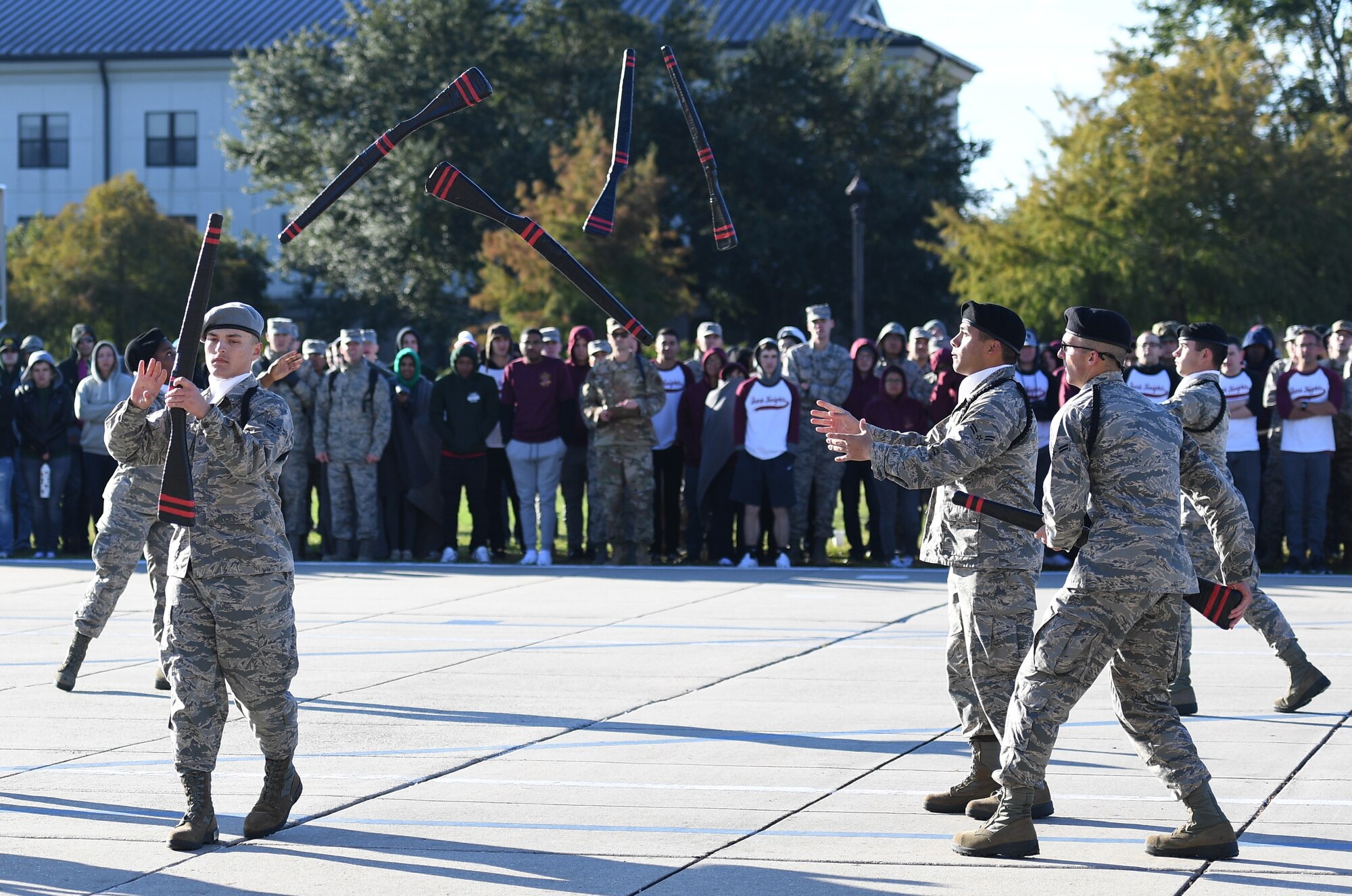 Members of the 335th Training Squadron freestyle drill team perform during the 81st Training Group drill down on the Levitow Training Support Facility drill pad at Keesler Air Force Base, Mississippi, Nov. 1, 2019. Airmen from the 81st TRG competed in a quarterly open ranks inspection, regulation drill routine and freestyle drill routine. Keesler trains more than 30,000 students each year. While in training, Airmen are given the opportunity to volunteer to learn and execute drill down routines. (U.S. Air Force photo by Kemberly Groue)