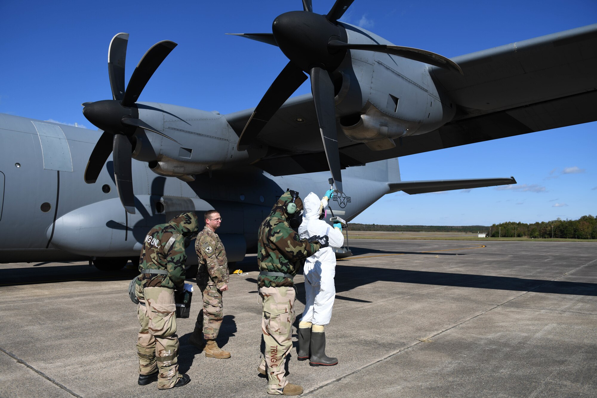 people inspect an aircraft