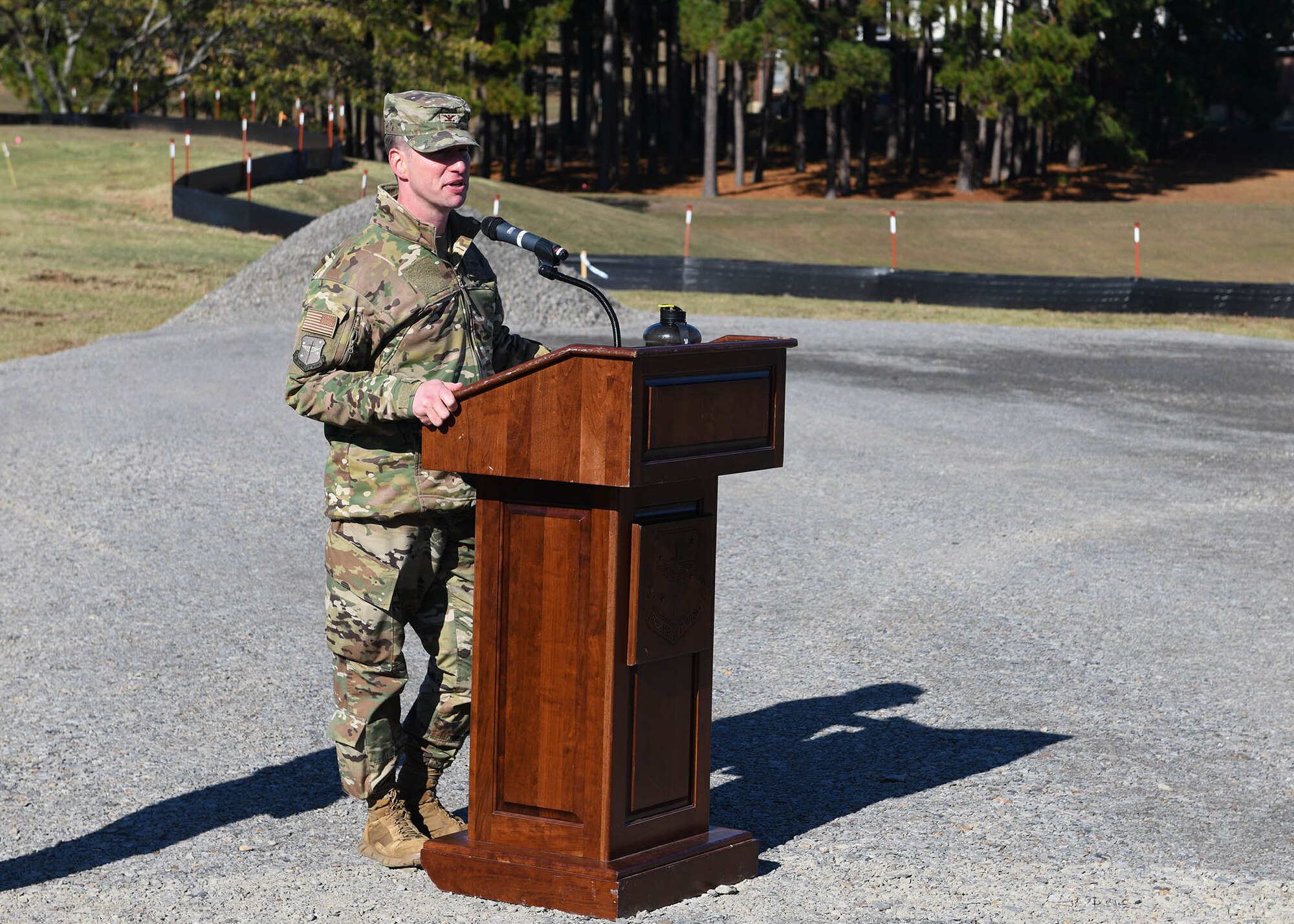 An Airman speaks at a podium