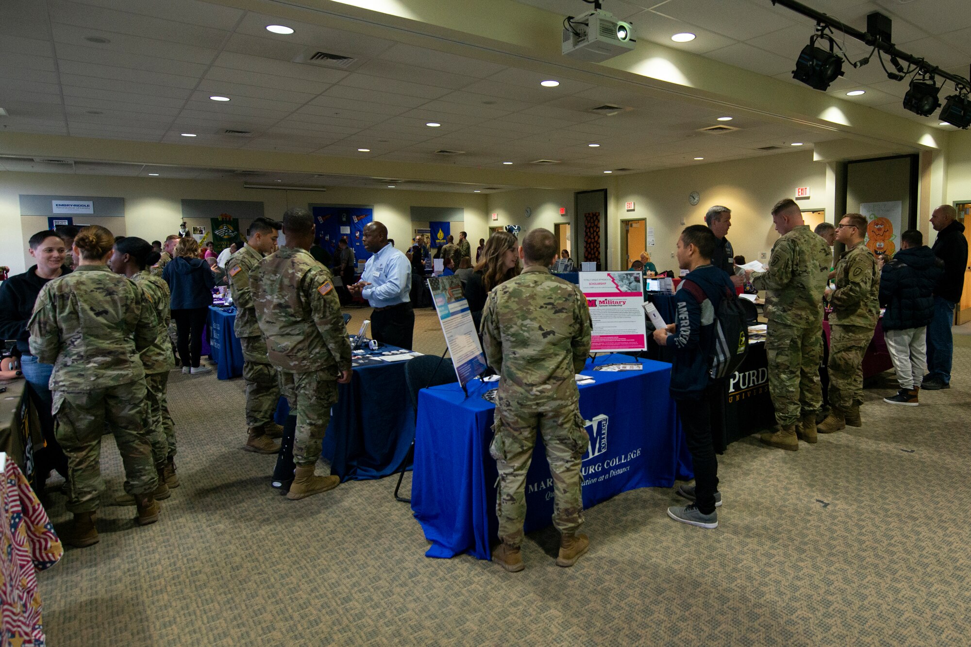 U.S. Soldiers assigned to U.S. Army Alaska attend the Fall Education Fair at Joint Base Elmendorf-Richardson, Alaska, Oct. 31, 2019. The JBER Army Education Center held the event, which allowed more than 20 vendors to showcase different educational opportunities.