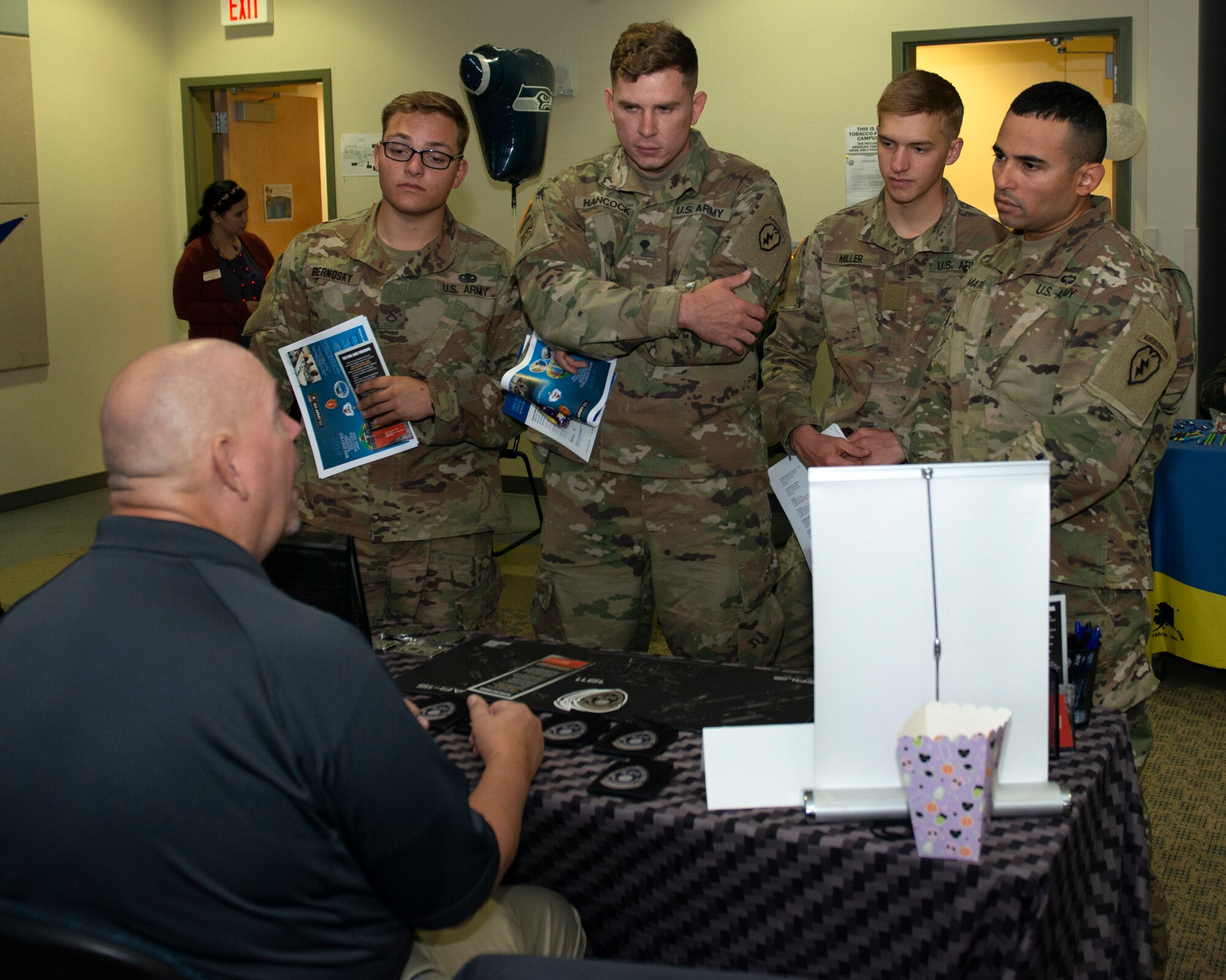 U.S. Soldiers assigned to U.S. Army Alaska attend the Fall Education Fair at Joint Base Elmendorf-Richardson, Alaska, Oct. 31, 2019. The JBER Army Education Center held the event, which allowed more than 20 vendors to showcase different educational opportunities.