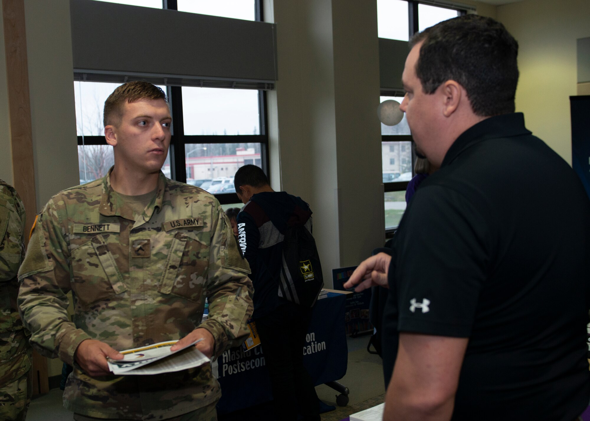 U.S. Army Pvt. Nicholas Bennett, an infantryman assigned to Comanche Company, 1st Battalion, 501st Parachute Infantry Regiment, 4th Infantry Brigade Combat Team (Airborne), 25th Infantry Division, U.S. Army Alaska, gathers information about colleges during the Fall Education Fair at Joint Base Elmendorf-Richardson, Alaska, Oct. 31, 2019. The JBER Army Education Center hosted the event, which allowed more than 20 vendors to showcase a variety of educational opportunities.