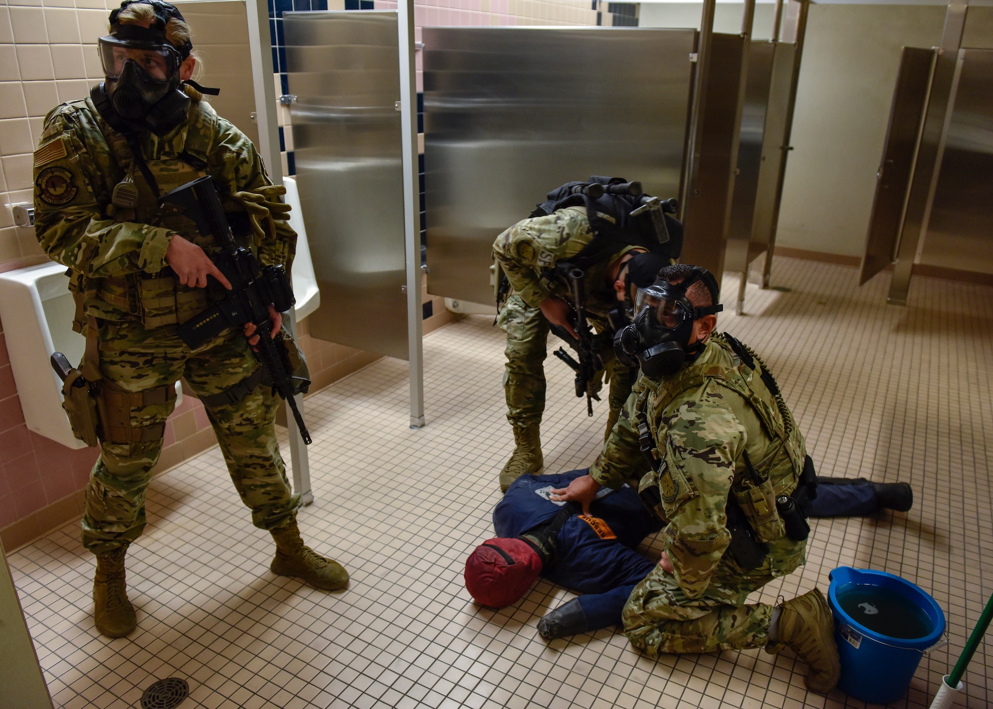 Team members from the 377th Security Forces Squadron Alpha Flight treat a simulated patient as part of a chemical, biological, radiological, nuclear and high–yield explosive emergency during exercise Global Thunder 20 at Kirtland Air Force Base, N.M., Oct. 24, 2019. Global Thunder is a worldwide exercise that provides training opportunities for all of U.S. Strategic Command’s mission areas, tests joint and field training operations, and has a specific focus on nuclear readiness. (U.S. Air Force photo by Airman 1st Class Austin J. Prisbrey)