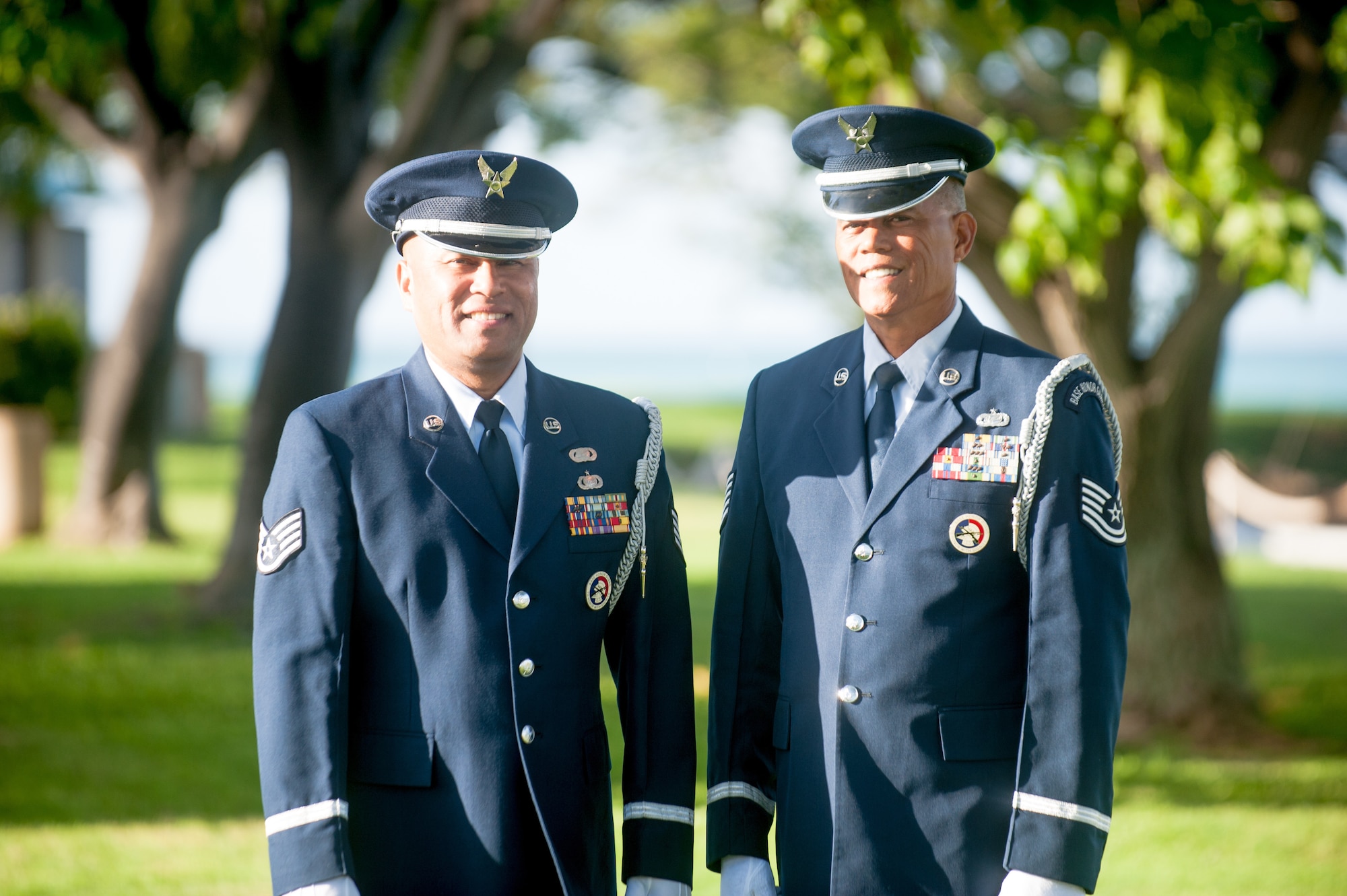Staff Sgt. Darrell Bactad and Tech. Sgt. Mark Crabbe, 204th Airlift Squadron information managers, gather to practice Honor Guard movements Oct. 4, 2019, at Joint Base Pearl Harbor-Hickam, Hawaii. The two friends have performed military ceremonies side-by-side in the Hawaii Air National Guard Honor Guard team since the early 2000s. Crabbe became an honor guardsmen in 2001 and Bactad joined in 1999, when the unit was established. (U.S. Air National Guard photo by Senior Airman John Linzmeier)