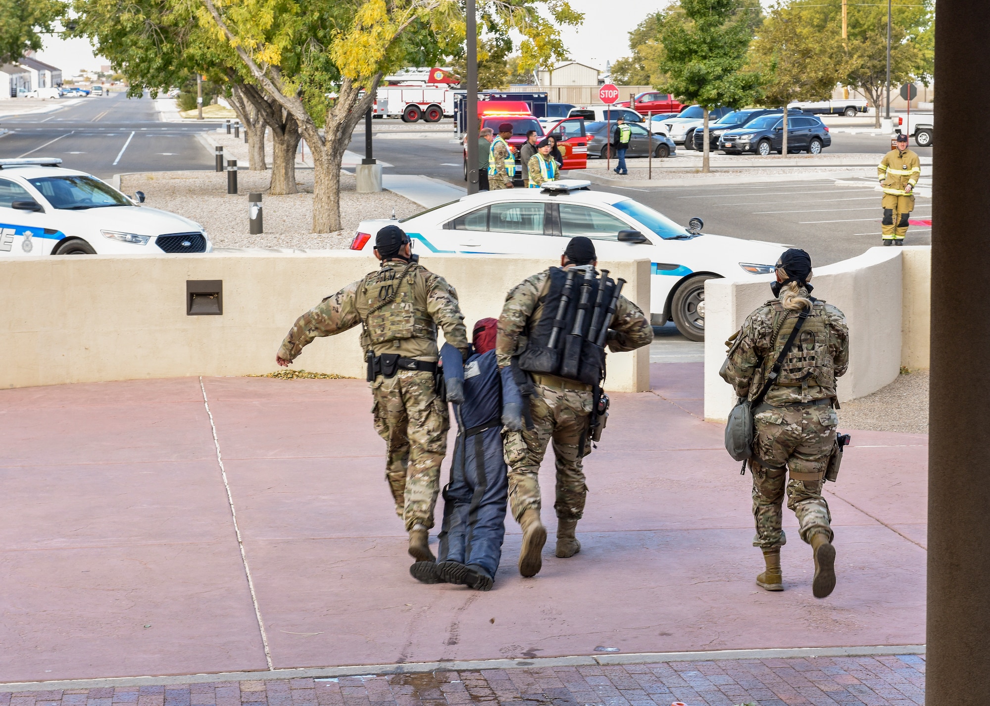 Team members from the 377th Security Forces Squadron Alpha Flight evacuate a simulated patient as part of a chemical, biological, radiological, nuclear and high–yield explosive emergency during exercise Global Thunder 20 at Kirtland Air Force Base, N.M., Oct. 24, 2019. Global Thunder is an annual U.S. Strategic Command exercise designed to provide training opportunities to test and validate command, control and operational procedures. (U.S. Air Force photo by Airman 1st Class Austin J. Prisbrey)