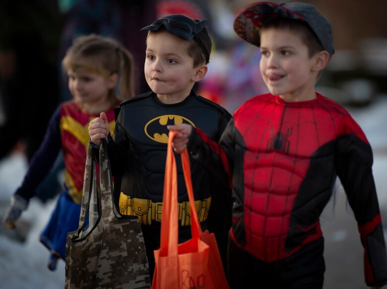 Gage, 4, left, and Ronan, 6, trick-or-treat at the annual trick-or-treat and Halloween Parade at Schriever Air Force Base, Colorado, Oct. 31, 2019. The event was open to all of team Schriever and their children.  (U.S. Air Force photo by Airman 1st Class Jonathan Whitely)