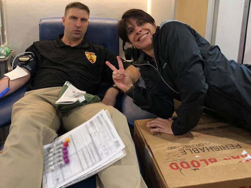 Maj. Charles Wyatt (left), executive officer, 5th Medical Recruiting Battalion, donates blood at a mobile blood drive hosted by the Armed Services Blood Program with Lt. Col. Mary Rivera (right), commander, 5th MRB, at the Jimmy Brought Fitness Center, Joint Base San Antonio-Fort Sam Houston, Texas, Oct. 30.