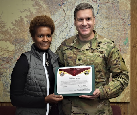IN THE PHOTO, Memphis District Commander Col. Zachary Miller presents Wynne Area Office Administrative Support Assistant Romona Oring with the Employee of the Month certificate for the month of October. (USACE photo by Jim Pogue)