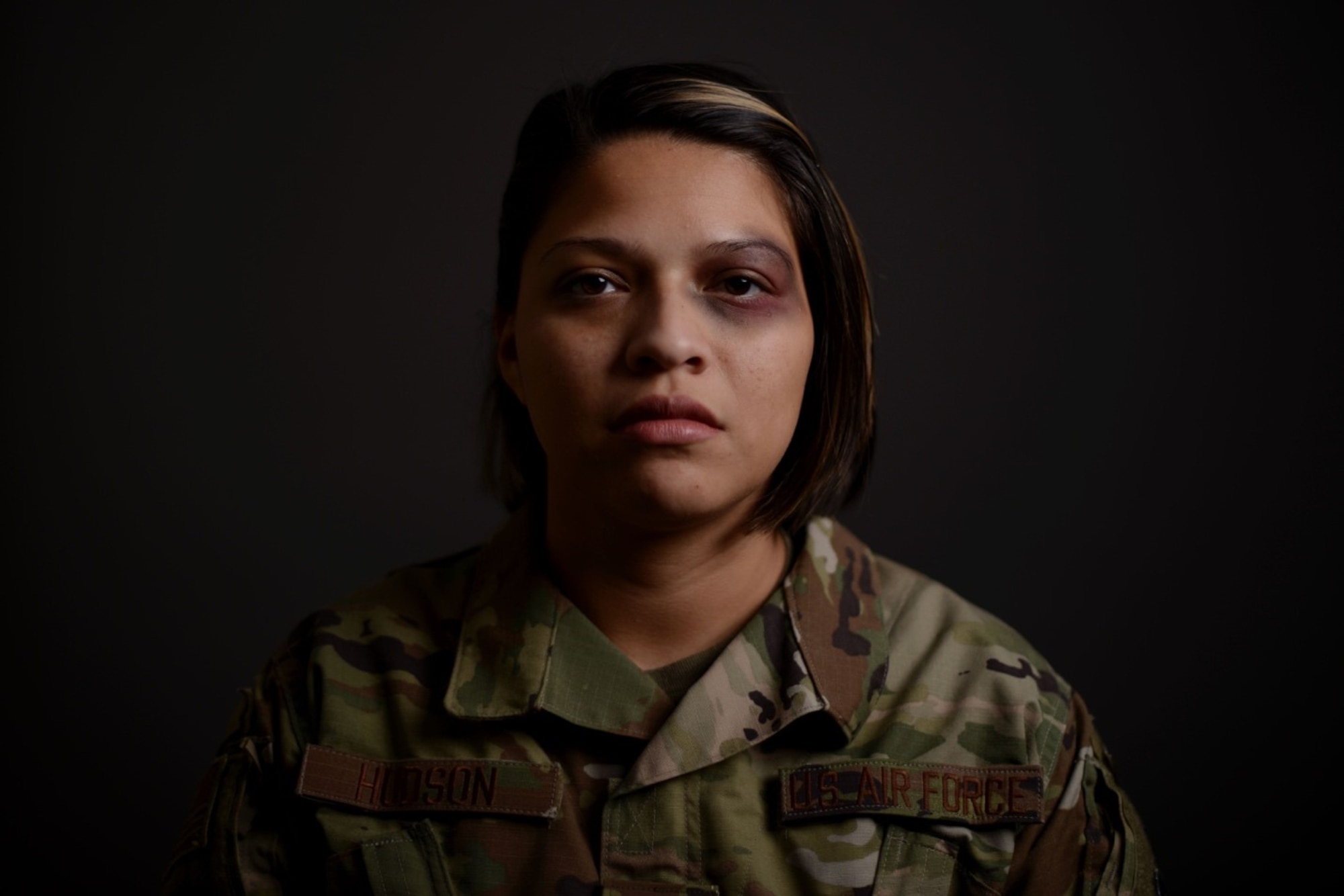 Senior Airman Jessica Hudson, 22nd Air Refueling Wing community support coordinator and violence prevention integrator assistant, displays a faux bruise on her eye Oct. 30, 2019, at McConnell Air Force Base, Kan. The Black Eye Campaign, hosted by McConnell’s Violence Prevention team, enabled volunteers to spend the day wearing a black eye in the hopes starting conversations and informing others of the stigmas surrounding domestic violence. The campaign sought to raise awareness and provide available resources for those affected. (U.S. Air Force photo by Airman 1st Class Nilsa E. Garcia)