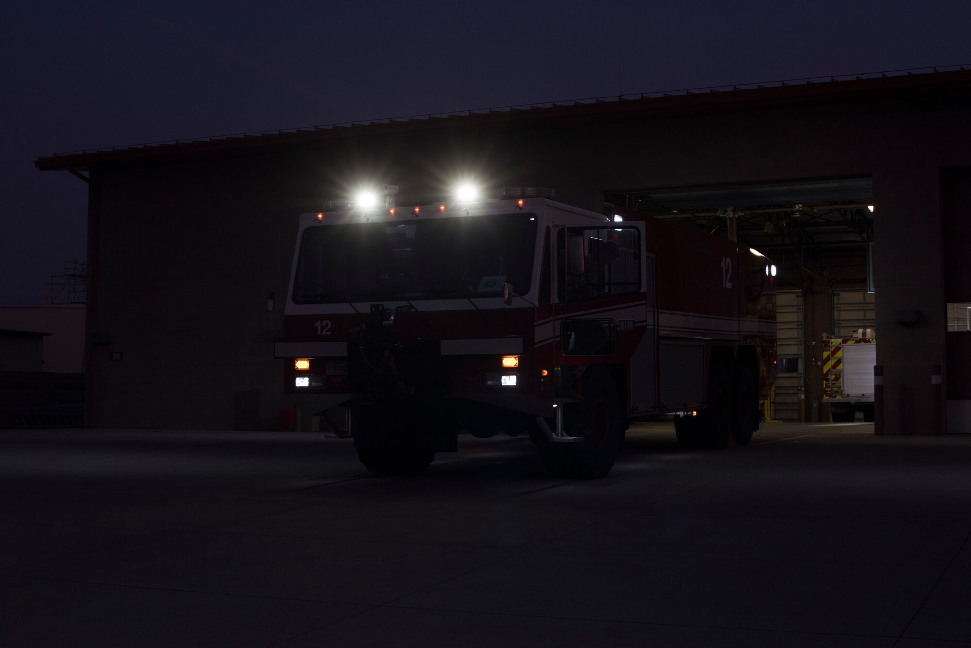 Firefighters assigned to the 60th Civil Engineer Squadron Fire and Emergency Services flight conduct vehicle checks Oct. 29, 2019, at Travis Air Force Base, California. The FES flight provides emergency response support at Travis AFB and across Solano County. (U.S. Air Force photo by Tech. Sgt. James Hodgman)