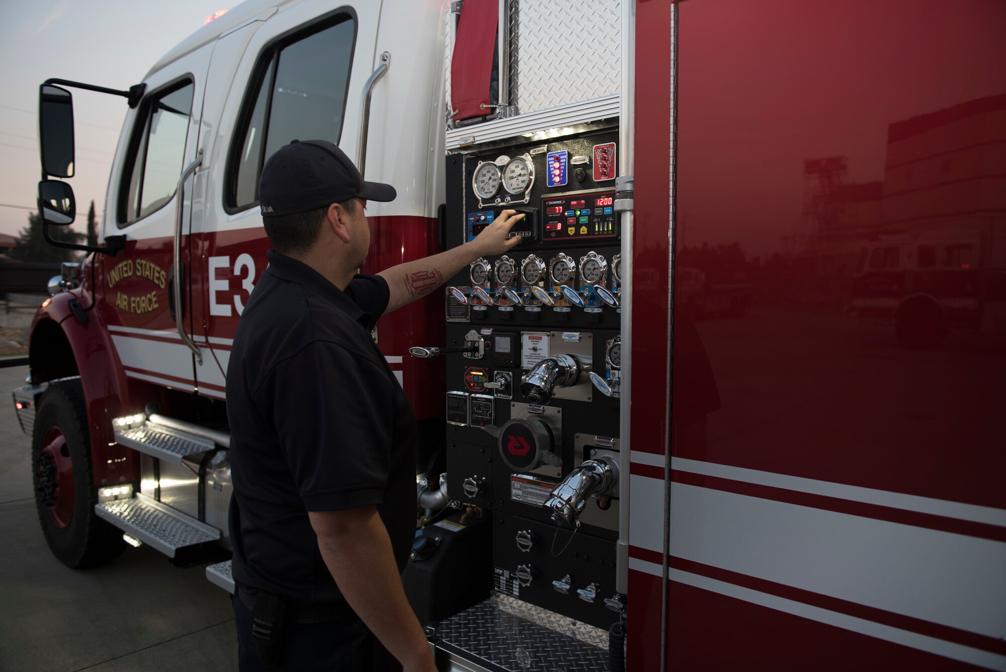 David Silva, 60th Civil Engineer Squadron Fire and Emergency Services flight engineer, conducts a check on equipment outside a firetruck Oct. 29, 2019, at Travis Air Force Base, California. With the start of every shift, the FES flight conducts inspections on more than 1,000 items including vehicles, protective equipment and hardware. (U.S. Air Force photo by Tech. Sgt. James Hodgman)
