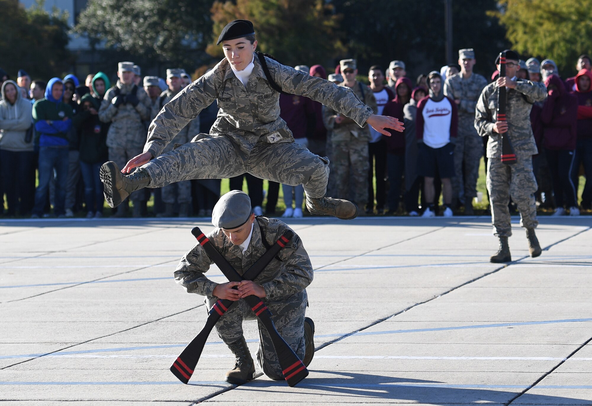 U.S. Air Force Airman Danielle Gaucher and Airman 1st Class Ethan Muncy, 335th Training Squadron freestyle drill team members, perform during the 81st Training Group drill down on the Levitow Training Support Facility drill pad at Keesler Air Force Base, Mississippi, Nov. 1, 2019. Airmen from the 81st TRG competed in a quarterly open ranks inspection, regulation drill routine and freestyle drill routine. Keesler trains more than 30,000 students each year. While in training, Airmen are given the opportunity to volunteer to learn and execute drill down routines. (U.S. Air Force photo by Kemberly Groue)