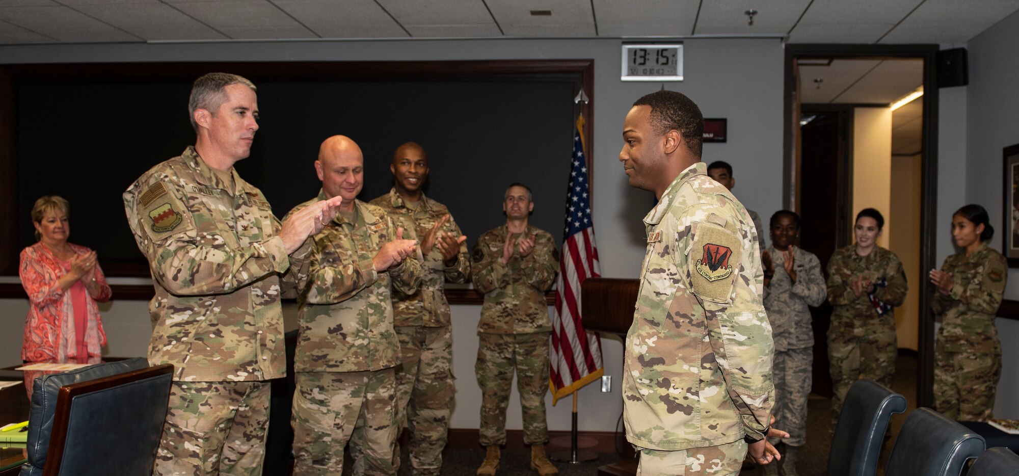 U.S. Air Force Col. Derek O’Malley, 20th Fighter Wing commander, left, applauds Staff Sgt. Darius Willingham, 20th Comptroller Squadron commander’s support staff at Shaw Air Force Base, South Carolina, Oct. 30, 2019.