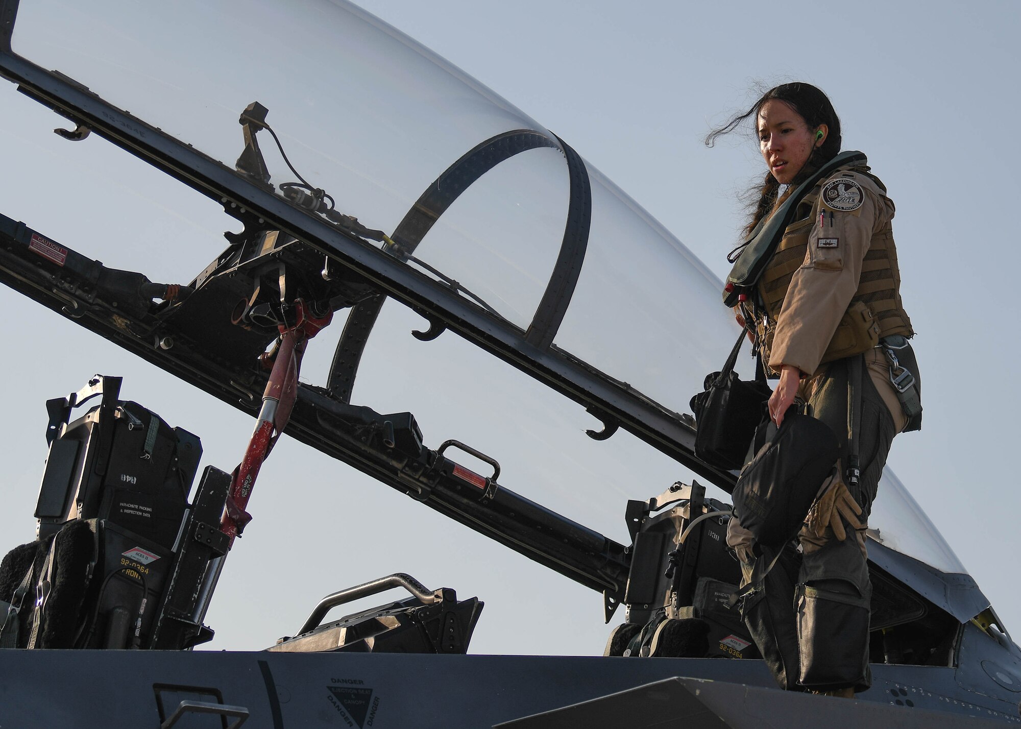 Weapons system officer exits a USAF F-15E Strike Eagle