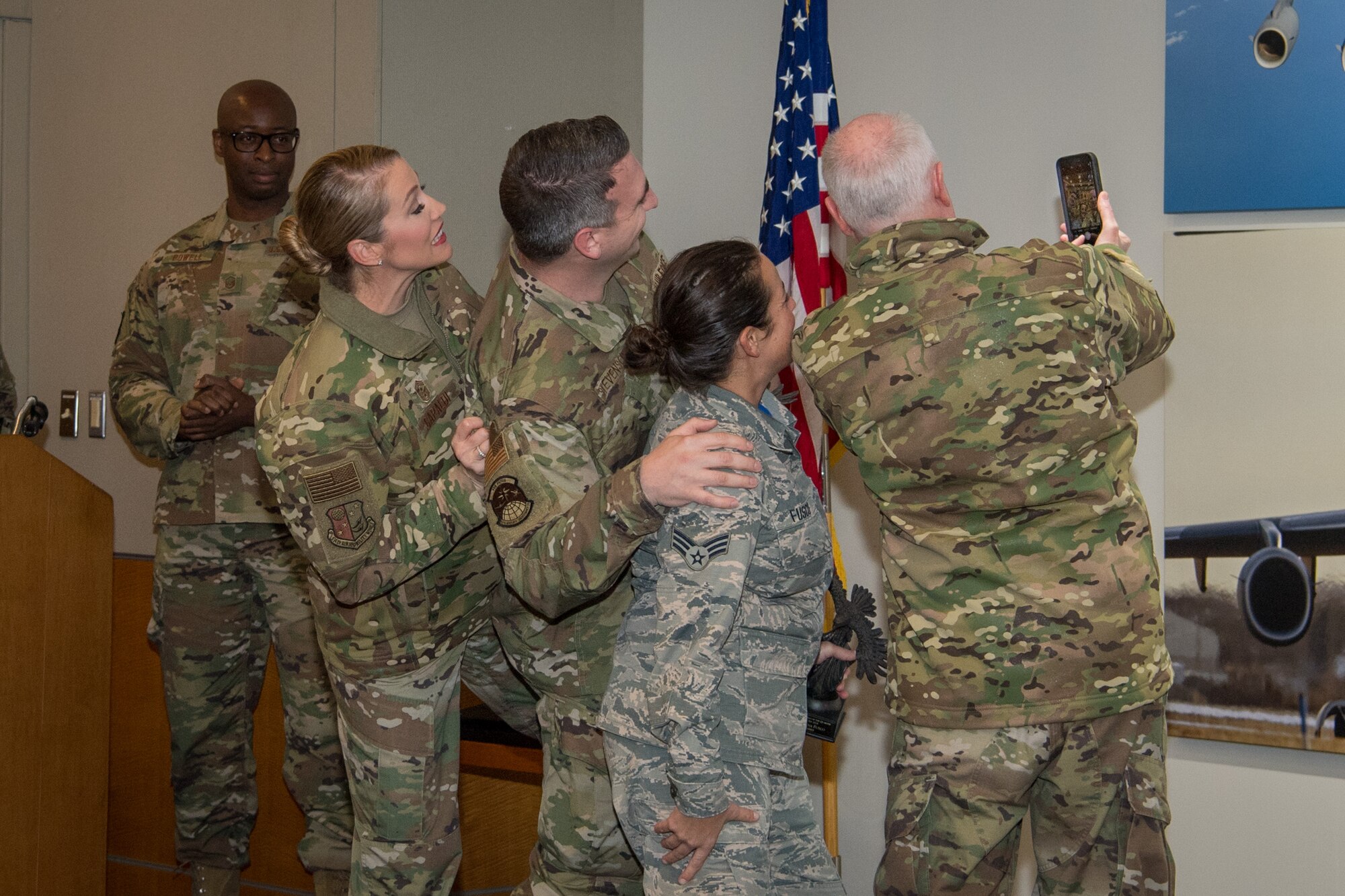 Tech. Sgt. Brentley Stevenson and Senior Airman Dana Fusco, 514th Aircraft Maintenance Squadron members, 514th Air Mobility Wing, Joint Base McGuire-Dix-Lakehurst, N.J., take a selfie photograph with Chief Master Sgt. Dana L. Capaldi, 514th AMW command chief and Col. Thomas O. Pemberton, 514th AMW commander, Nov. 2, 2019. Stevenson and Fusco won quarterly awards for the months of July through September. (U.S. Air Force photo by Senior Airman Ruben Rios)