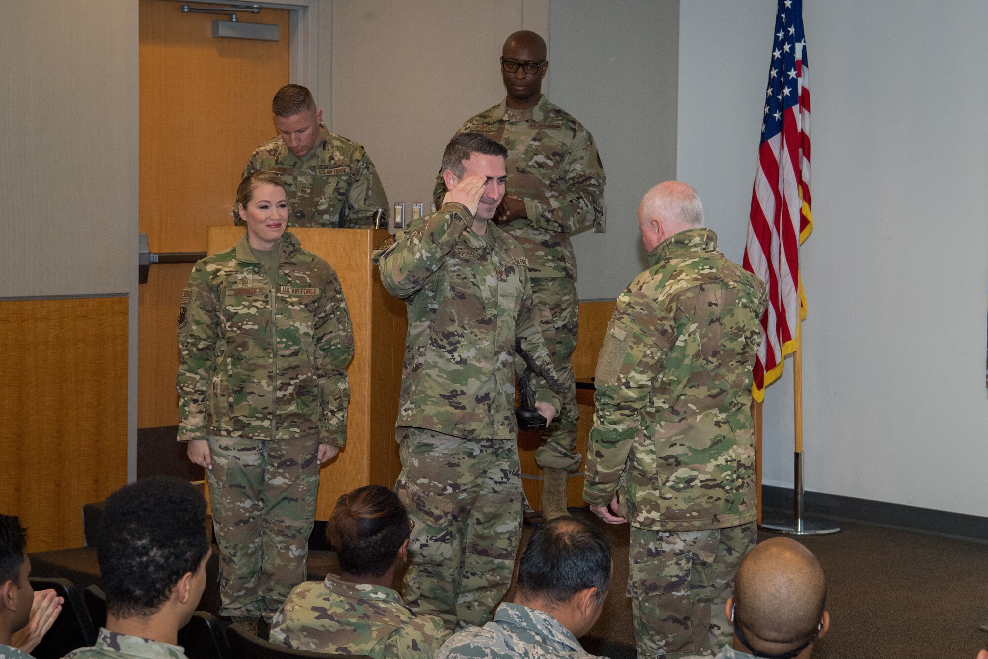Tech. Sgt. Brentley Stevenson, 514th Aircraft Maintenance Squadron member, 514th Air Mobility Wing, Joint Base McGuire-Dix-Lakehurst, N.J., salutes Col. Thomas O. Pemberton, 514th AMW commander, Nov. 2, 2019. Stevenson received the Noncommissioned Officer of the Quarter Award for the months of July through September. (U.S. Air Force Photo by Senior Airman Ruben Rios)