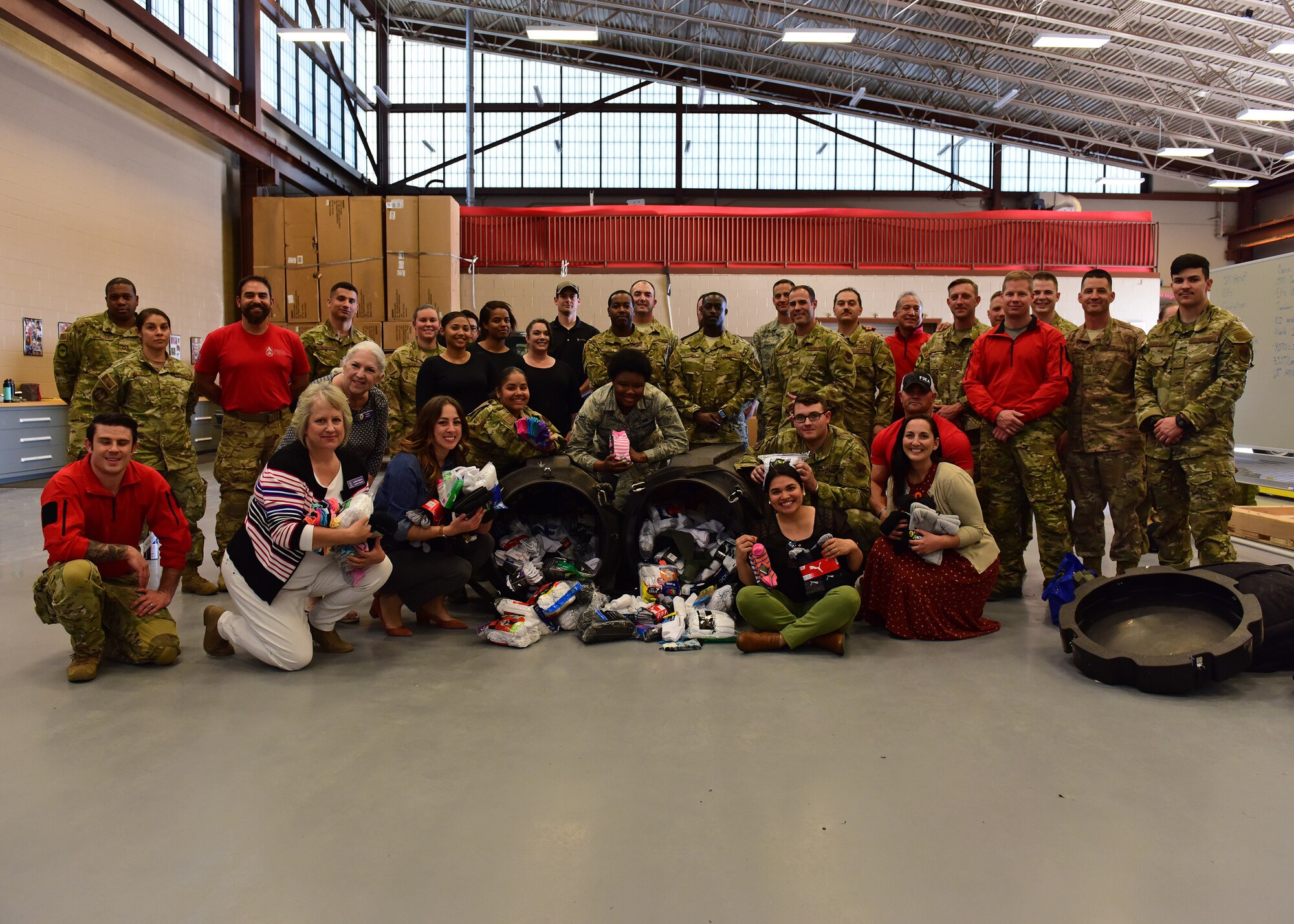 a photo of airmen prepping to donate socks
