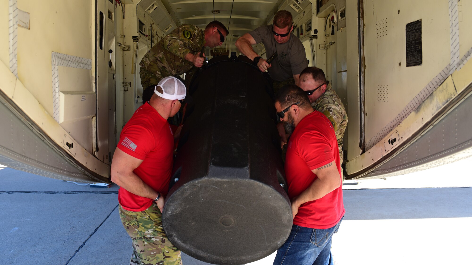 a photo of airmen prepping to donate socks