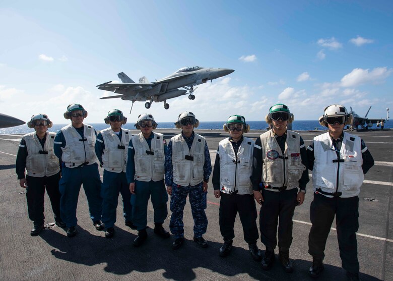 The aircraft carrier USS Ronald Reagan (CVN 76), the Ticonderoga class guided-missile cruiser USS Chancellorsville (CG 62) and the Akizuki class destroyer JS Fuyuzuki (DD 118) from the Japan Maritime Self Defense Force sail in formation while conducting a bilateral exercise. Ronald Reagan and Chancellorsville and forward-deployed to the U.S. 7th Fleet area of operations in support of security and stability in the Indo-Pacific region.