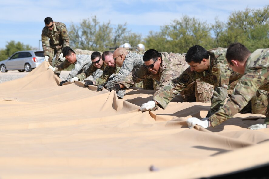 a photo of airmen learning how to build tents