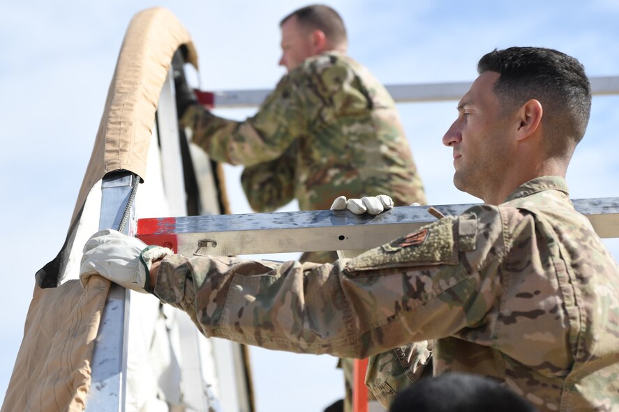 a photo of airmen learning how to build tents