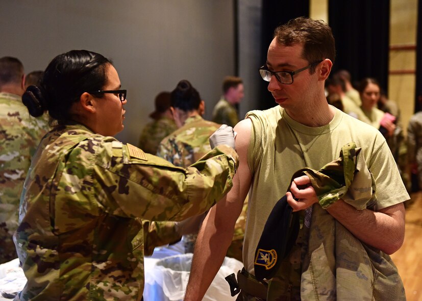 A U.S. Air Force Airmen receives his yearly flu immunization during a simulated deployment medical processing line at Davis-Monthan Air Force Base, Arizona, Oct. 28, 2019. (U.S. Air Force photo by Staff Sgt. Sergio A. Gamboa)