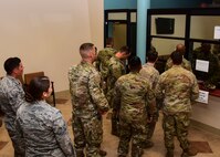 a photo of airmen going through medical processing lines
