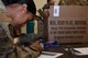 Senior Airman Angel Akino, 355th Force Support Squadron fitness apprentice, issues out Meals Ready to Eat at the end of the personnel deployment function line for Exercise Bushwhacker 19-08 at Davis-Monthan Air Force Base, Arizona, Cct. 31, 2019. The personnel deployment function line is a streamlined process that helps Airmen rapidly deploy in support of the Dynamic Wing. (U.S. Air Force photo by Airman 1st Class Blake Gonzales)