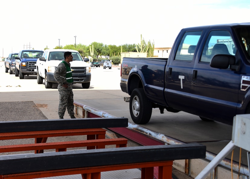 U.S. Air Force Airman Verdugo Rodolfo, 355th Logistics Readiness Squadron cargo deployment function inventory specialist, watches as trucks weigh in during exercise Bushwhacker 19-08 at Davis-Monthan Air Force Base, Arizona, Oct. 30, 2019. Davis-Monthan is proving the Dynamic Wing concept as it continues to lead the Air Force in operational readiness. (U.S. Air Force photo by Airman 1st Class Jacob T. Stephens)